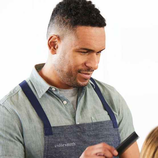 Expert colorist holding a comb